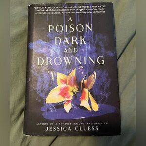 A Posion Dark and Drowning by Jessica Cluess